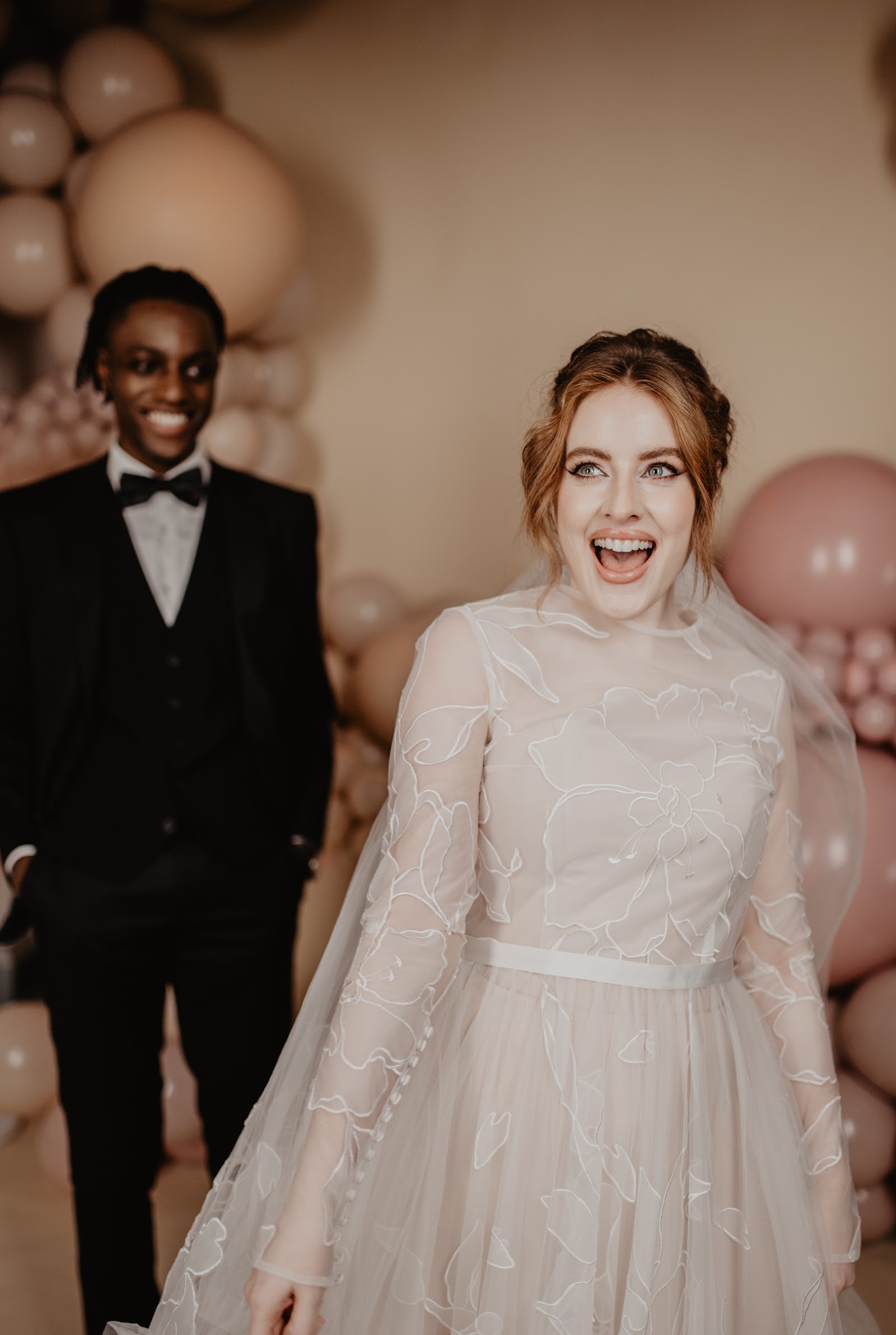Guests celebrating with balloon decor