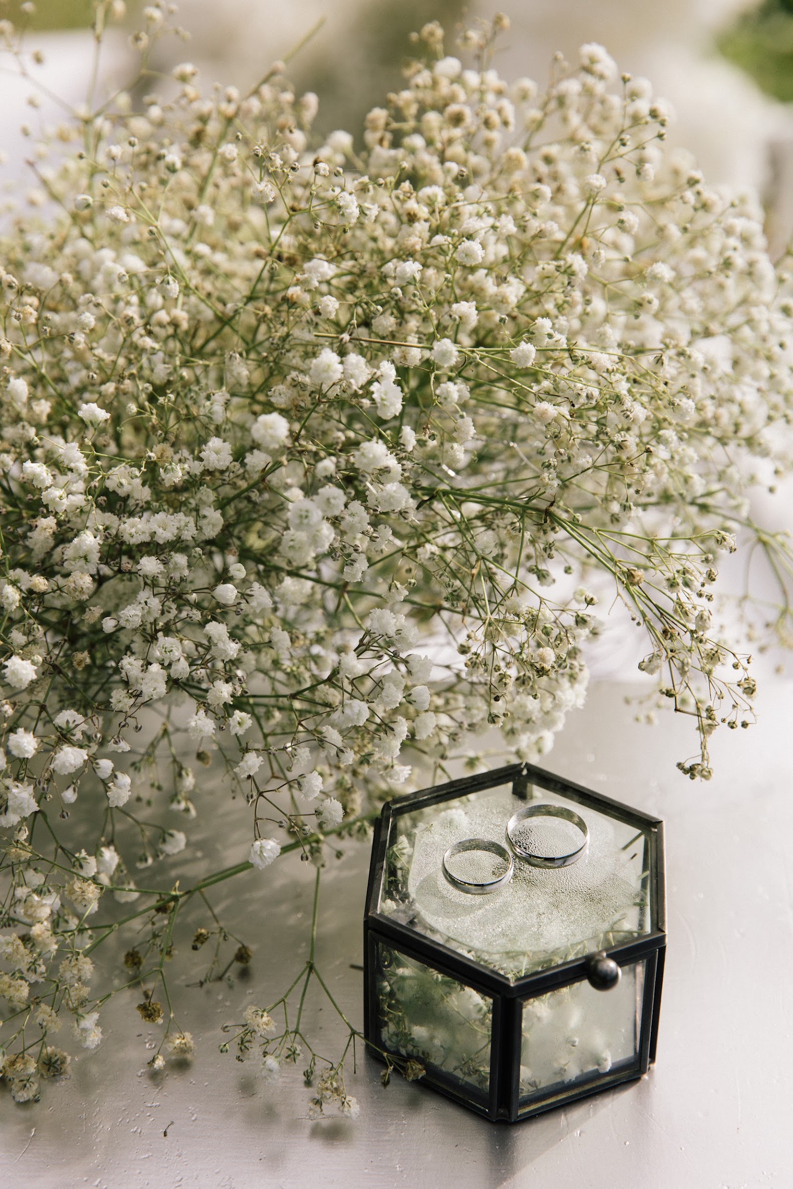 Baby's breath florals with wedding rings