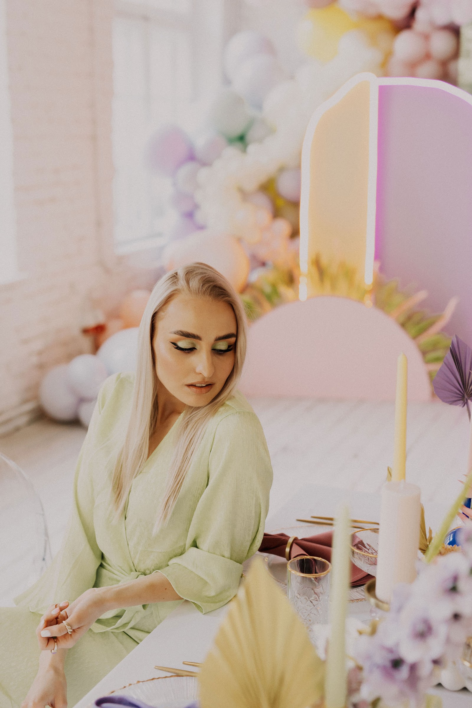 Pastel balloon photozone with a styled table — real client install